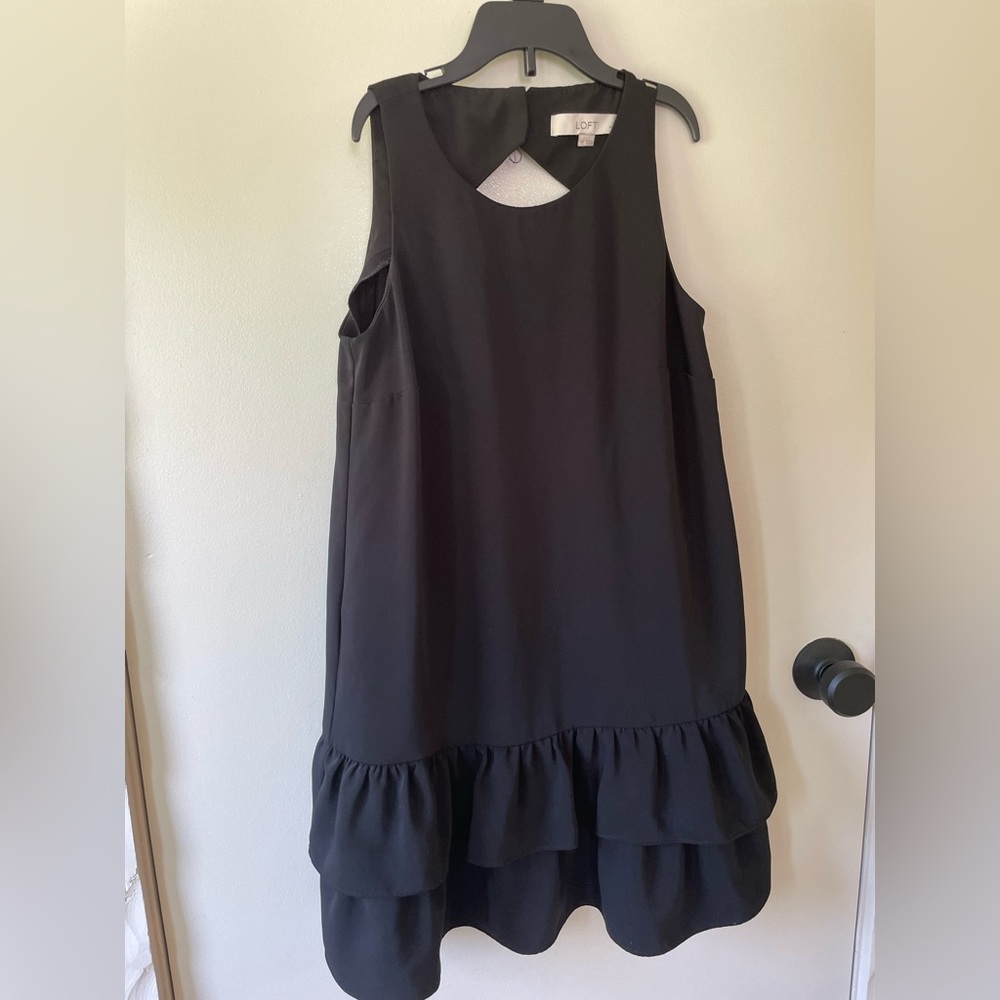 Perfect LBD with a high next and peplum bottom.